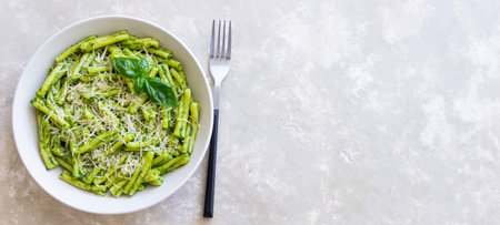 Pasta casarecce with pesto sauce, basil and cheese. Italian cuisine. Vegetarian foodの写真素材
