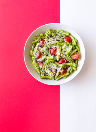 Pasta casarecce with pesto sauce, tomatoes and cheese. Italian cuisine. Vegetarian food.の写真素材