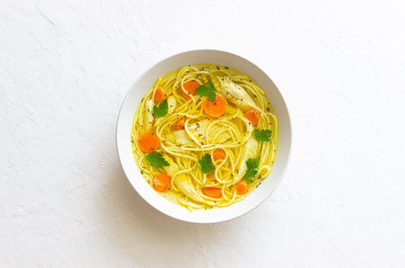 Noodle soup with chicken, carrots and greens. Healthy eating. Diet