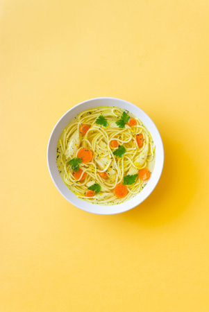 Noodle soup with chicken, carrots and greens. Healthy eating. Diet