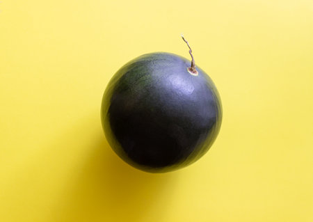 Watermelon on a yellow background. Healthy eating. Vegetarian food. Minimalismの写真素材
