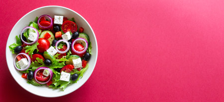 Greek salad with feta cheese, tomatoes, onion, cucumbers, peppers and olives. Healthy eating. Vegetarian foodの写真素材