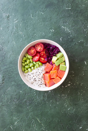 Poke bowl with rice, salmon, avocado, red cabbage, edamame and tomatoes. Healthy food. Diet