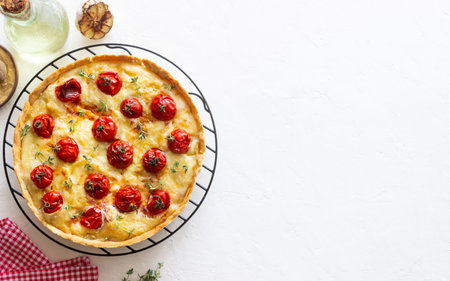 Quiche with cheese, tomatoes, and thyme. Pie. Pastries. Vegetarian food