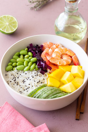 Hawaiian poke bowl with rice, shrimp, red cabbage, radish, edamame, and mango. Healthy eating. Diet