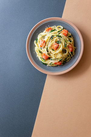 Pasta spaghetti with salmon, spinach, and cheese. Italian cuisine. Healthy eatingの写真素材