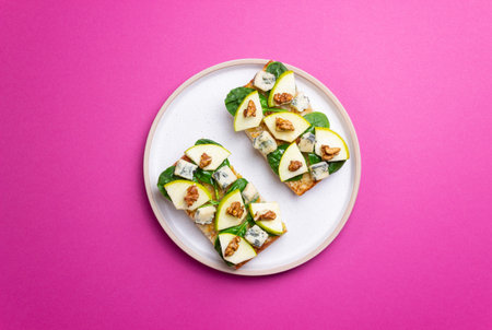 Bruschetta with spinach, honey, blue cheese, pear, and nuts. Healthy eating. Vegetarian foodの写真素材