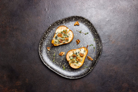 Baked pear with blue cheese, honey, and nuts. Healthy eating. Vegetarian foodの写真素材