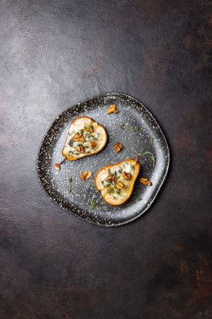 Baked pear with blue cheese, honey, and nuts. Healthy eating. Vegetarian foodの写真素材