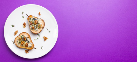 Baked pear with blue cheese, honey, and nuts. Healthy eating. Vegetarian foodの写真素材