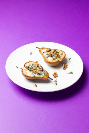 Baked pear with blue cheese, honey, and nuts. Healthy eating. Vegetarian foodの写真素材