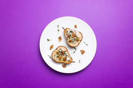 Baked pear with blue cheese, honey, and nuts. Healthy eating. Vegetarian foodの写真素材
