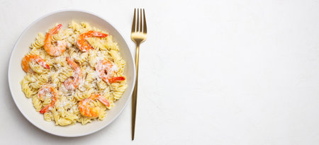 Pasta in a creamy sauce with shrimp and cheese. Italian cuisineの写真素材