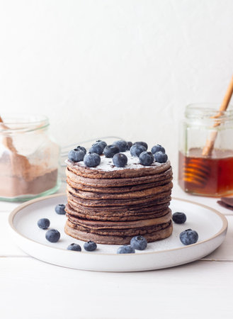 Chocolate pancakes with blueberries. Vegetarian food. Breakfastの写真素材