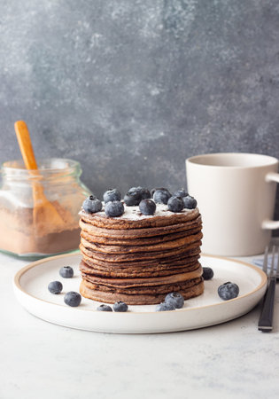 Chocolate pancakes with blueberries. Vegetarian food. Breakfastの写真素材