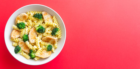 Pasta with chicken and broccoli in a creamy sauce. Italian cuisineの写真素材