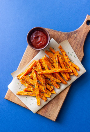 Baked sweet potatoes with ketchup. Healthy eating. Vegetarian food