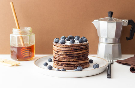 Chocolate pancakes with blueberries. Vegetarian food. Breakfastの写真素材