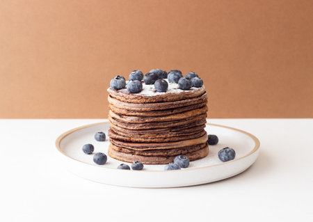Chocolate pancakes with blueberries. Vegetarian food. Breakfastの写真素材