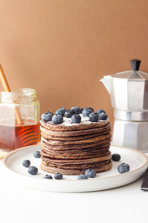 Chocolate pancakes with blueberries. Vegetarian food. Breakfastの写真素材