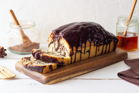 Marble loaf cake glazed with chocolate. Vegetarian food. Bakery