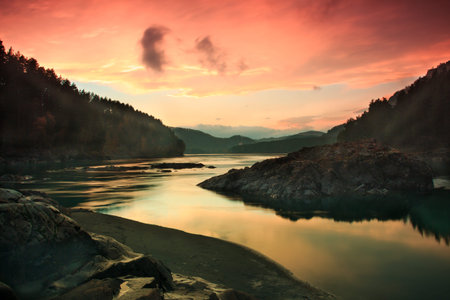 sunset over the river in the mountains