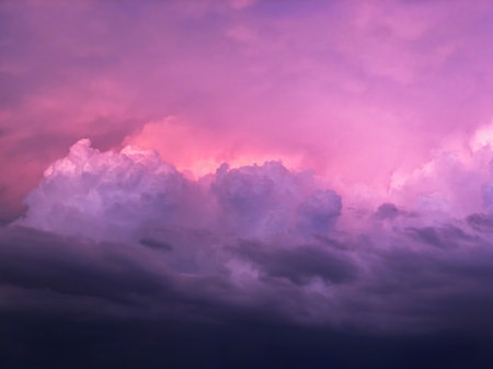 Landscape of purple and pink majestic clouds in the sky at dusk. The concept of the beauty of natureの写真素材