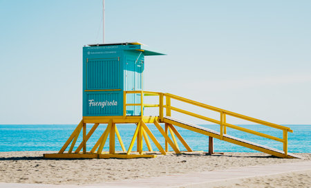 A lifeguard tower is on a sandy beach with a direct rampの写真素材