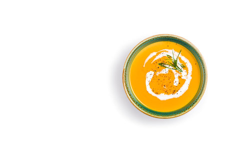 Pumpkin soup isolated on white background. top view. copyspace.の写真素材