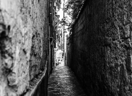 Black and white photo of a narrow street in Sorrento, Italy.の写真素材