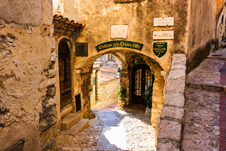 Narrow alley and old stone houses in Eze village in France.のeditorial素材