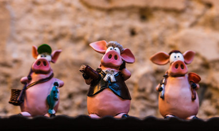 Eze, France - 2019.Solft focus photo of three little pigs toys.