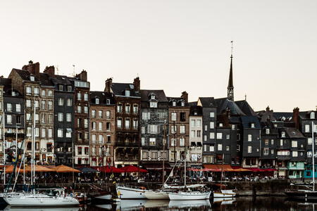 Hondleur, France - 2019.Spectacular famous harbor in Normandy, Honfleur skyline and water with boats.のeditorial素材