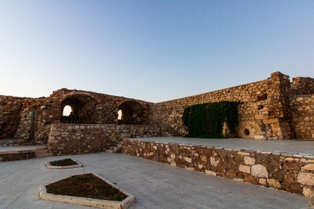 Old buildings in the venetian harbour of Chania at sunset, Crete, Greece.の写真素材