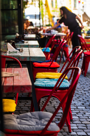 Bucharest, Romania - 2019. Colorful wooden tables on the narrow street of Bucharest Old Town.のeditorial素材
