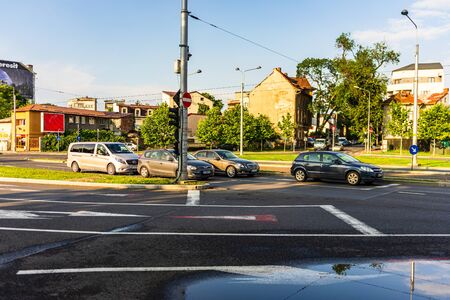 Bucharest, Romania - 2019. Traffic on the main bulevard of Bucharest. Downtown Bucharest junction with stopped cars.のeditorial素材