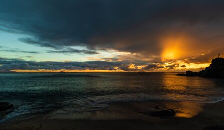 Travel photo of St. Barthâs Island (St. Bartâs Island), Caribbean. View of a peaceful sunset and waves on Shell Beach.の写真素材