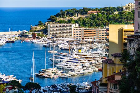Monte Carlo, Monaco â 2019. Monte Carlo city panorama and harbor with yachts and sail boats.のeditorial素材
