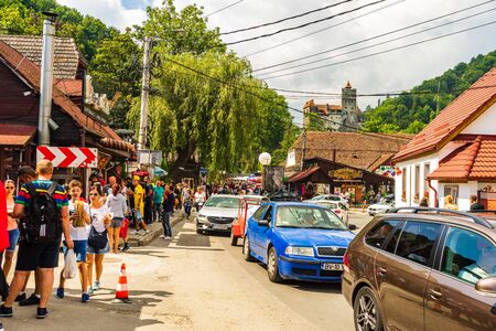 Bran, Romania â 2019. People on their way to Bran Castle (Castelul Bran). Legendary historical castle of Dracula in Transylvania, Brasov region.のeditorial素材