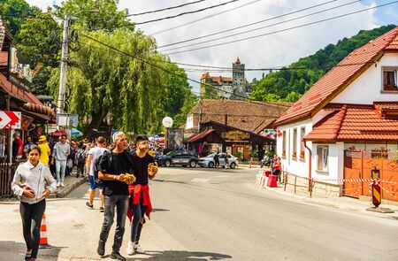 Bran, Romania â 2019. People on their way to Bran Castle (Castelul Bran). Legendary historical castle of Dracula in Transylvania, Brasov region.のeditorial素材