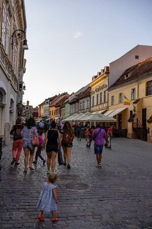 Brasov, Romania - 2019. People wandering on the streets of Brasov old town.のeditorial素材
