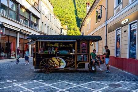 Brasov, Romania â 2019. Crapes (pancakes) being sold at a wooden food cart.のeditorial素材