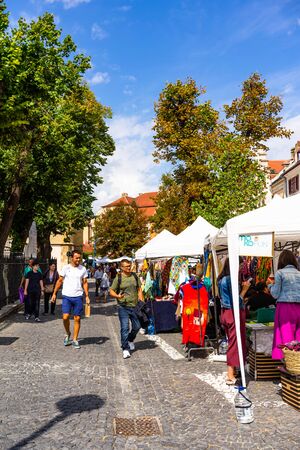 Sibiu, Romania - 2019. Tourists looking for souvenirs at local artisans shops in downtown Sibiu.のeditorial素材