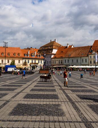 Sibiu, Romania - 2019. Tourists wandering in The Big Square of Sibiu (Piata Mare).のeditorial素材
