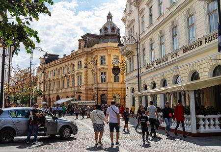 Sibiu, Romania - 2019. People wandering on the streets of Sibiu (old town). Streets with colorful houses.のeditorial素材