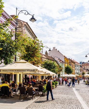 Sibiu, Romania - 2019. People and tourists having lunch and wandering on the streets of Sibiu old town.のeditorial素材