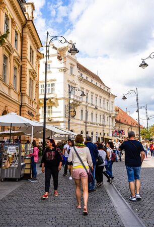 Sibiu, Romania - 2019. People and tourists having lunch and wandering on the streets of Sibiu old town.のeditorial素材