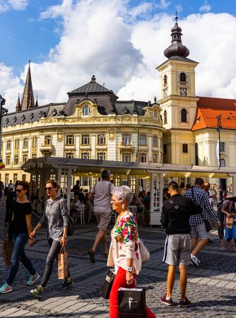 Sibiu, Romania - 2019. Tourists wandering in The Big Square of Sibiu (Piata Mare).のeditorial素材