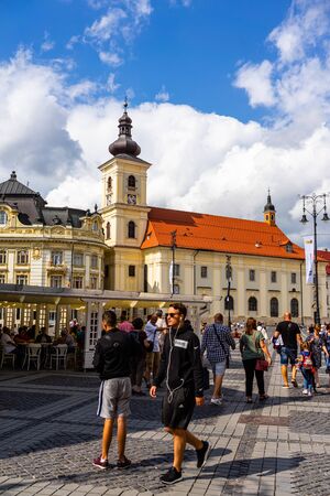 Sibiu, Romania - 2019. Tourists wandering in The Big Square of Sibiu (Piata Mare).のeditorial素材