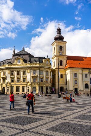 Sibiu, Romania - 2019. Tourists wandering in The Big Square of Sibiu (Piata Mare).のeditorial素材